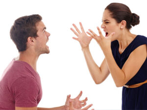 Man and woman gesturing angrily, representing a heated argument or conflict.